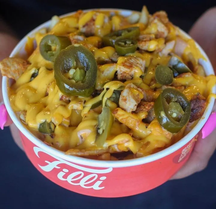 FiLLi Signature Loaded Fries with cheese sauce and jalapeños