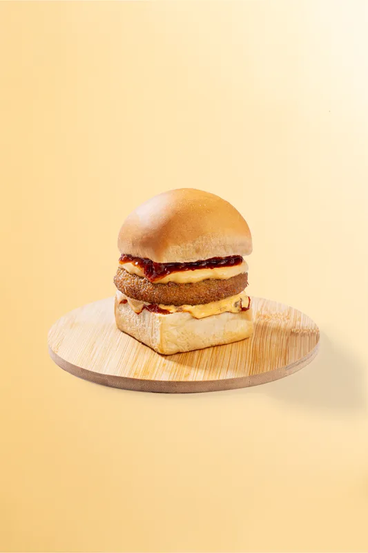 Vegetable burger served with fries