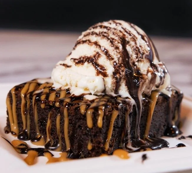 Chocolate brownie served with vanilla ice cream