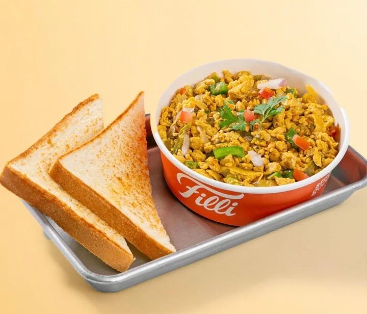 Masala egg scramble served with toast