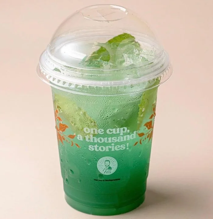 Green Passion Blue Mist mocktail over ice