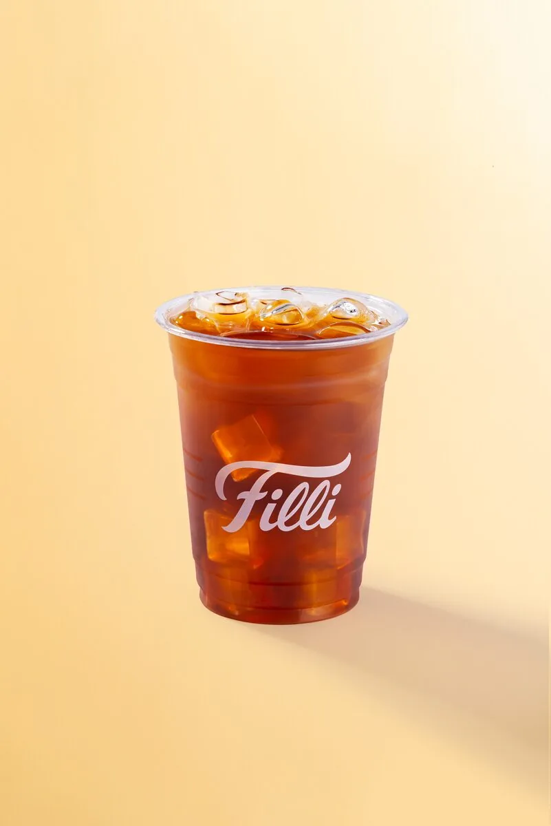 Clear FiLLi cup of amber passion fruit iced tea
