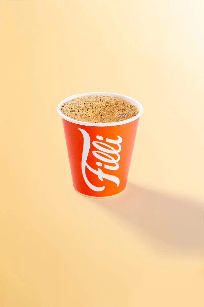 Orange FiLLi cup filled with Karak Chai