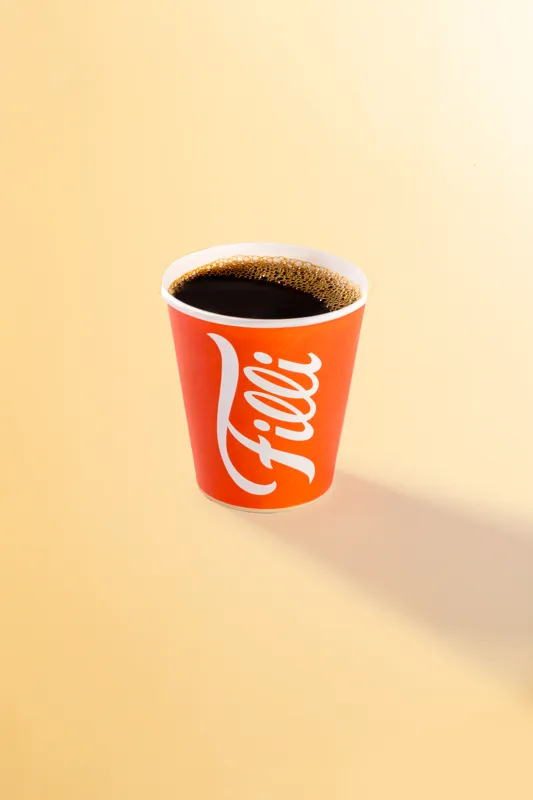 Orange FiLLi cup filled with Americano coffee