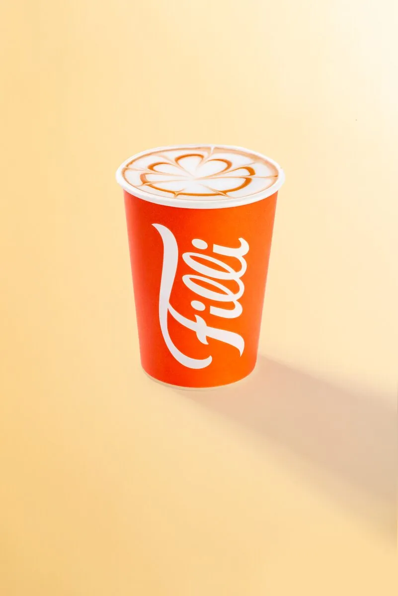 Orange FiLLi cup filled with caramel latte