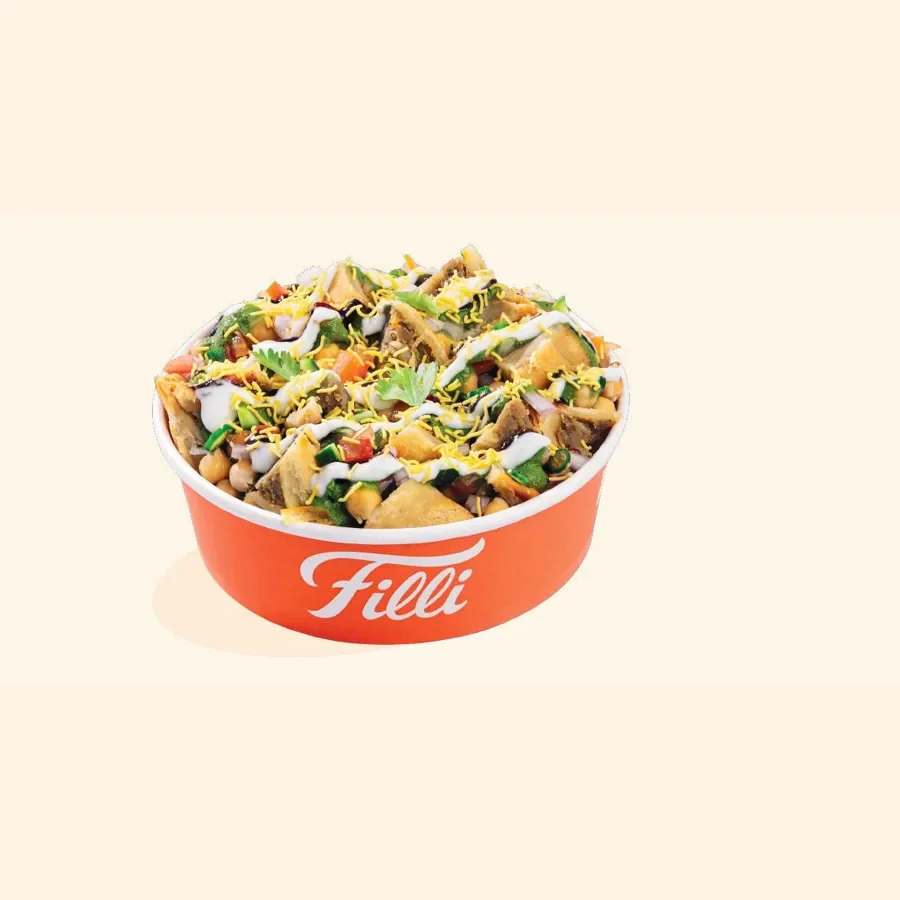 A red FiLLi Cafe bowl of chaat with chopped vegetables, chutneys and crisp toppings, from the printed FiLLi chaat menu page