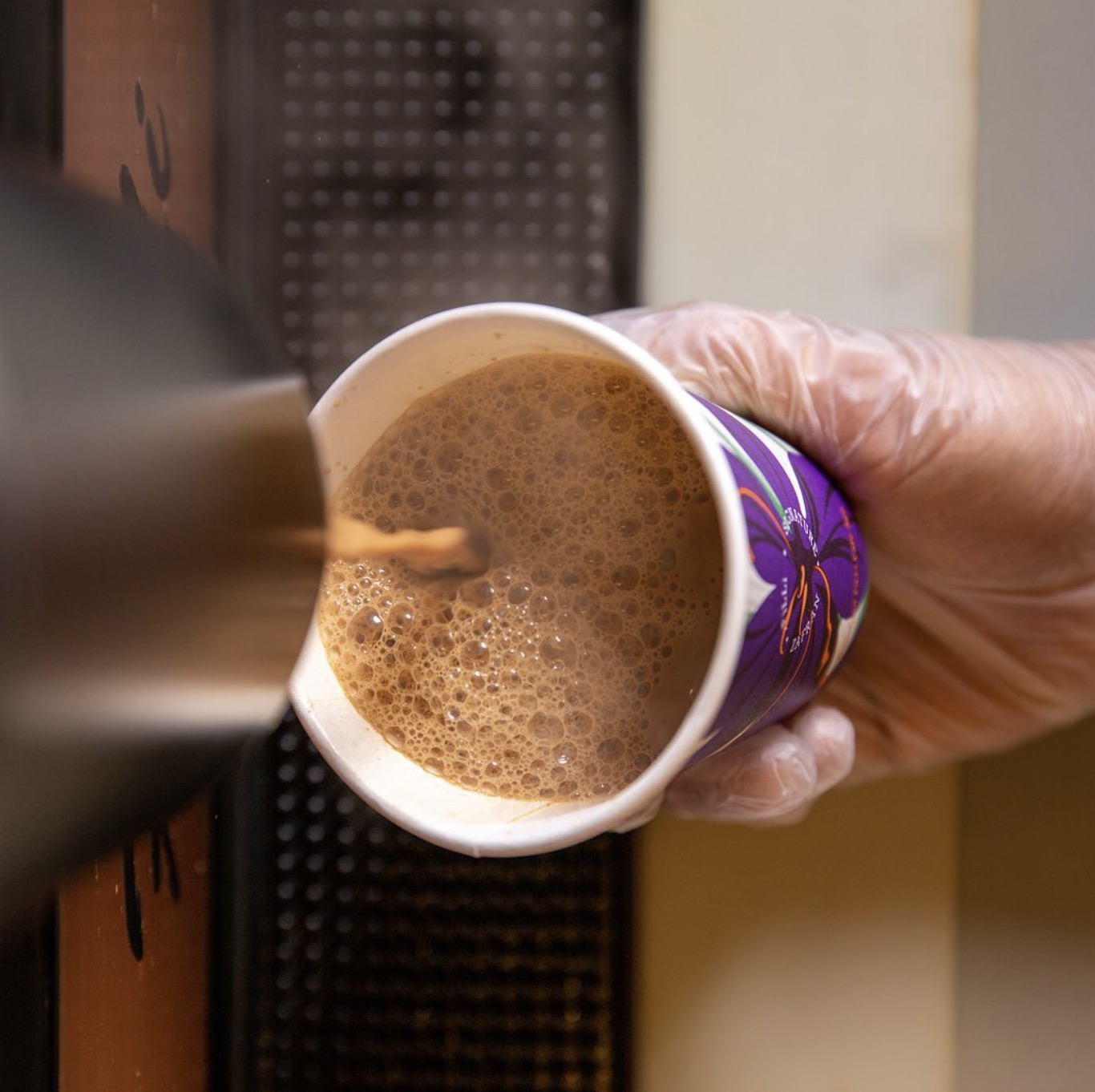 Zafran chai being poured