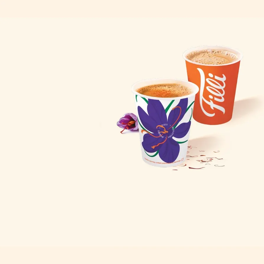 Two FiLLi Cafe chai cups, one with the saffron-flower Zafran design, from the printed FiLLi chai menu page